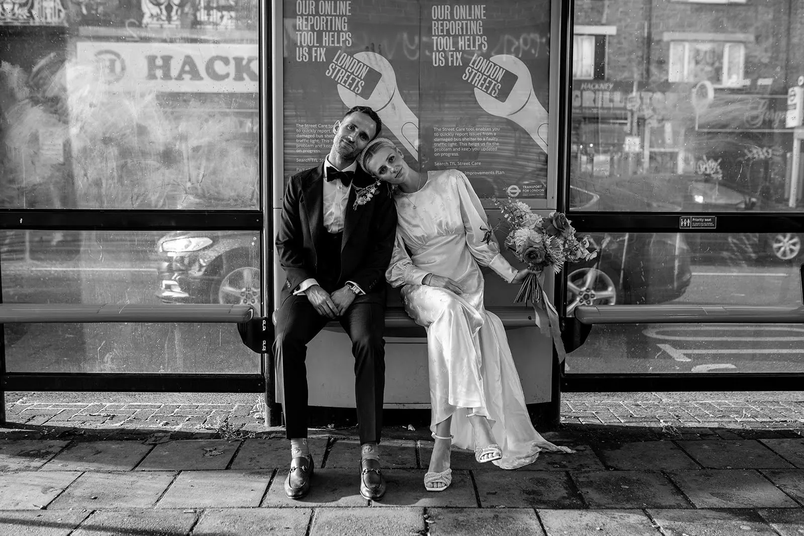 Couple walking along Hackney Road outside The Hackney venue in East London