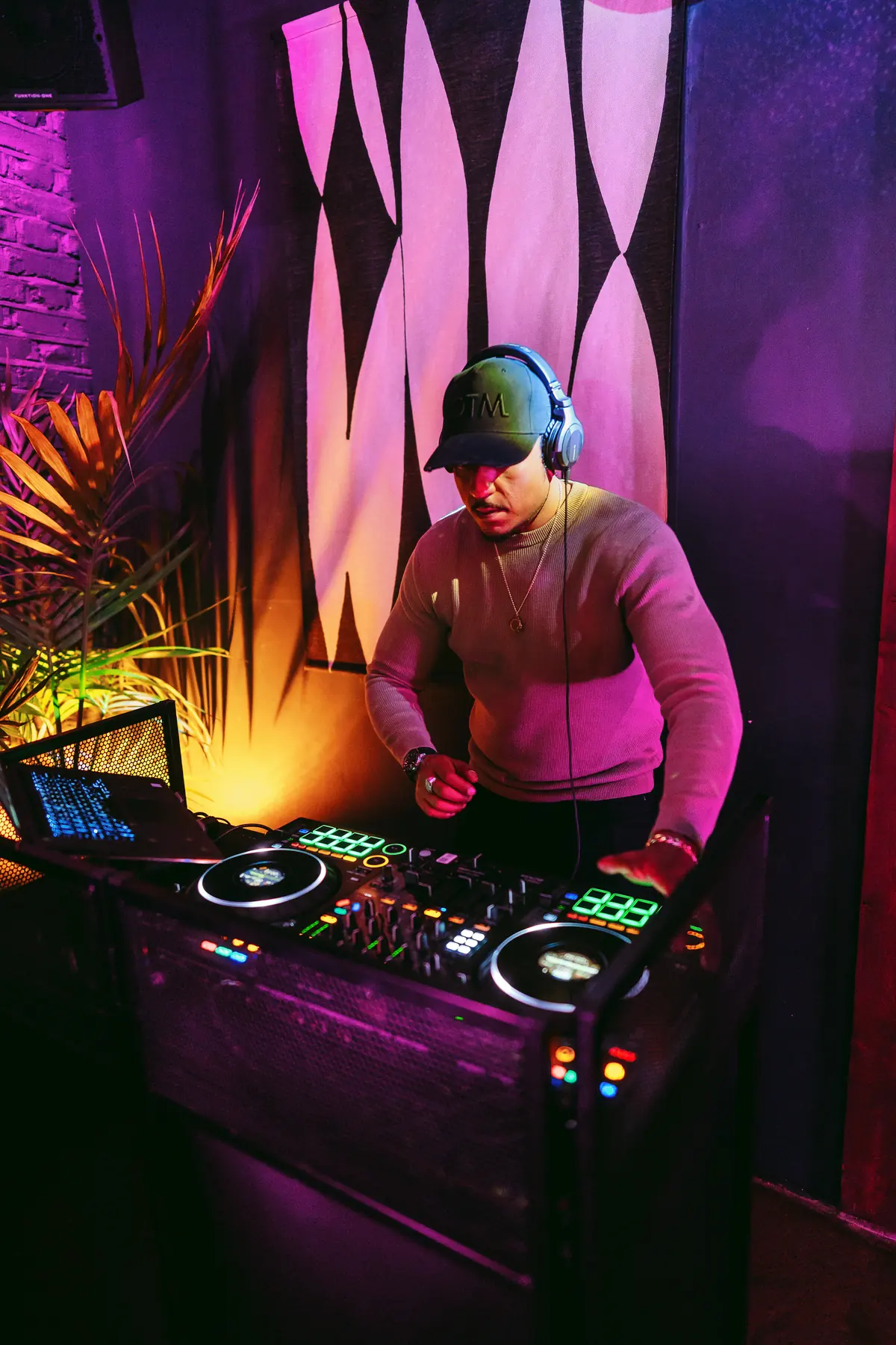 A DJ at the booth beneath the Funktion-One speakers at The Hackney